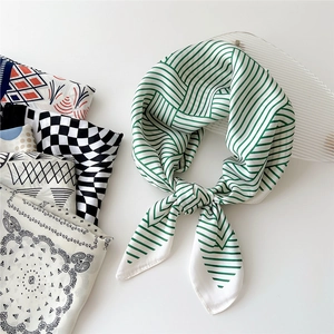 70cm square silk scarf featuring green geometric patterns and various fashion prints