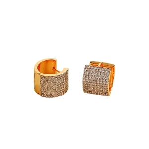 Elegant gold U-shaped heart earrings featuring sparkling pavé crystals on white background