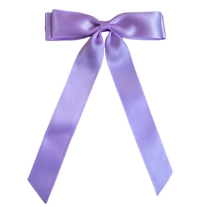 Detailed view of lavender satin double-layered bow hair clip with long ribbons on white background