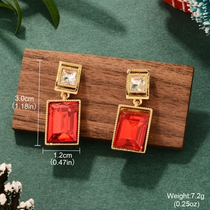 Detail showing dimensions of red square drop earrings with gold finish and rhinestones