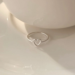 Minimalist 925 sterling silver open ring with hollow heart charm on ceramic base