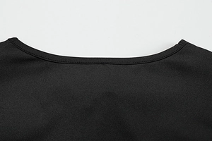 Detail of the round neckline on a black long sleeve dress with double stitching