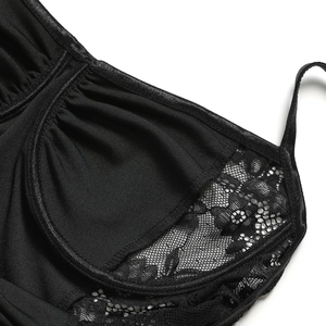 Close-up of black bra interior detailing with delicate lace stitching and soft lining