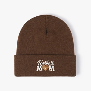 Close-up of Football MOM embroidery on dark brown ribbed knit beanie hat