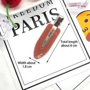Detailed close-up of 6cm brick red duckbill hair clip with silver metal base measurements