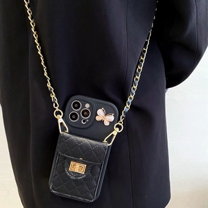 Black quilted crossbody iPhone case with golden turn-lock pocket and butterfly detail