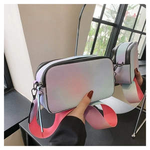 Detail of colorful gradient crossbody camera bag with dual zippers and wide shoulder strap