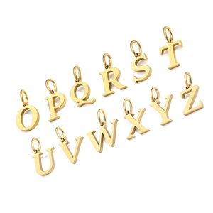 Detailed close-up of golden alphabet pendants O to Z on a clean white background