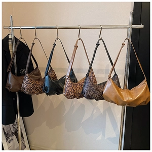 Detailed row of various solid colors and leopard print large capacity crescent bags