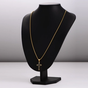 Minimalist gold stainless steel cross pendant necklace displayed on a black bust stand