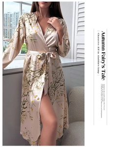 Detailed view of champagne satin robe featuring cherry prints and elegant waist tie closure