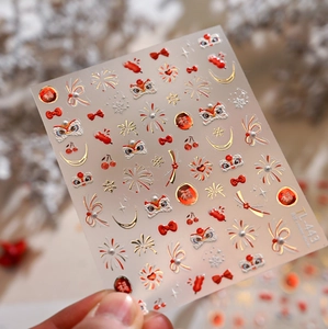 Detail of 5D embossed Chinese New Year nail stickers with gold lion and firework patterns