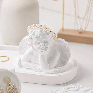 White angel jewelry display stand with pearl bracelet and matching oval tray base