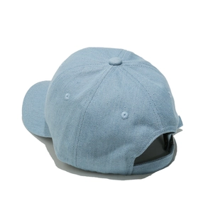 Detail view of the adjustable strap and stitching on this light blue denim baseball cap