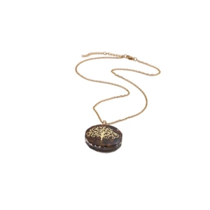 Detail of tree of life pendant featuring tiger eye crystal stones on a gold chain