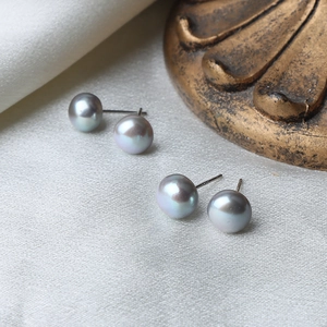 Natural gray freshwater pearl stud earrings with S925 silver needles on silk fabric