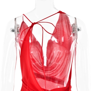 Detail of red backless dress showing adjustable thin straps and mesh fabric texture