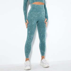 Close-up of seamless teal acid-wash yoga leggings with ribbing and high waist