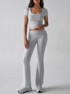 Detail of light gray Y2K two-piece set featuring square neck crop top and flared leggings