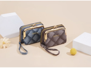 Close-up of woven texture mini coin purses in navy and brown with golden metal buckle