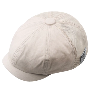 Detail of summer mesh octagonal cap showing breathable hollow mesh and side brand label