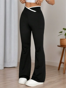 Women's high waist flared knit trousers with crossover white contrast waistband