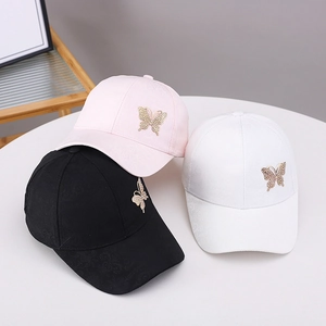 Set of baseball caps with rhinestone butterfly and jacquard pattern in black, pink, and white
