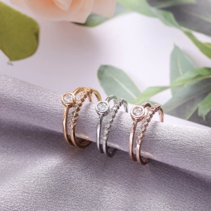 Three sets of double-layer geometric rings in gold, silver, and rose gold with zircons