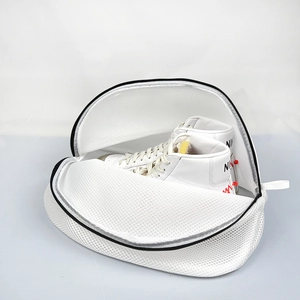 Close-up of thick mesh laundry bag with black zipper for protecting shoes in washing machine
