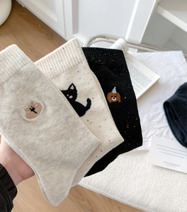 Close-up of cute dog embroidery on breathable thin knit cotton mid-calf socks