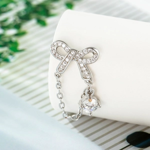 Elegant 925 silver bow stud earrings with sparkling cubic zirconia and dangling stones