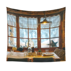Detail of fabric wall tapestry featuring a cozy vintage interior window with snow view