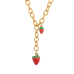 Detailed view of the 18K gold Y-shaped necklace featuring red strawberry charms