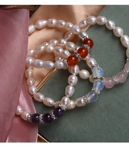 Detailed view of natural pearl bracelets with amethyst, agate, and moonstone accents