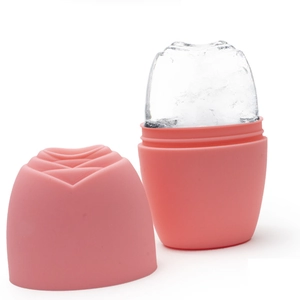 Detailed view of pink rose-shaped silicone ice roller with a formed ice cube for face massage
