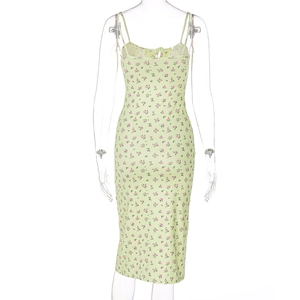 Back view of a slim-fit light green floral midi dress with spaghetti straps on a mannequin