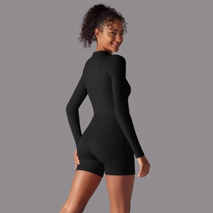 Side view of black long sleeve athletic romper with stand collar and slim fit design