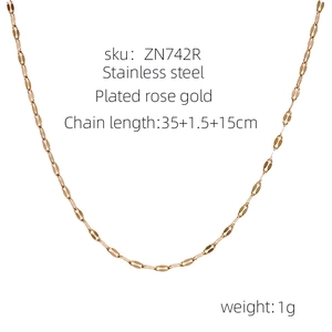 Detailed macro view of a rose gold stainless steel lip chain necklace with measurements