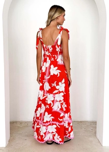 Detail of red floral maxi dress showing back tie straps and open back design