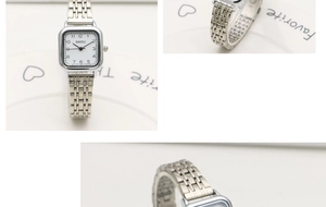 Detail of square silver quartz watch featuring classic multi-link steel strap and white dial