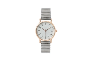 Detailed close-up of white textured dial with rose gold case and silver elastic watch band