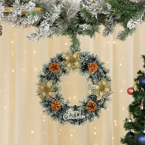 Christmas wreath with artificial pine needles, snow frost, pine cones and gold flowers