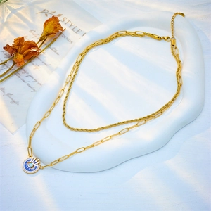 Double-layered gold evil eye pendant necklace with paperclip and rope chain design