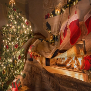 Close-up of soft Christmas tree tapestry showing detailed fireplace print and festive lights