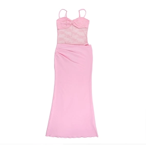 Detail of pink bodycon dress featuring sheer lace bodice and high-waist slit skirt