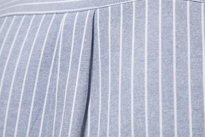 Close-up of blue and white striped cotton-linen shirt fabric with premium woven texture