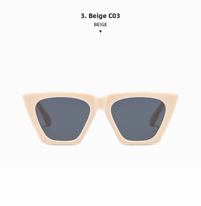 Dettaglio di occhiali da sole moderni cat-eye con montatura beige opaca e lenti scure
