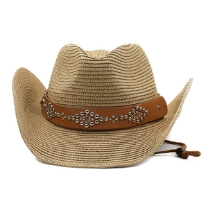 Detail of woven straw cowboy hat with studded leather band and adjustable wind rope