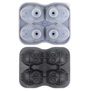 Silicone owl ice cube mold in light blue and dark grey with four shaped cavities