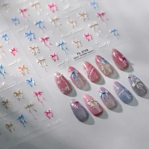 3D embossed bow nail art stickers with butterfly designs in pink and blue colors